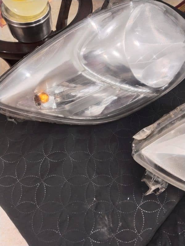 vitz 2007 model headlights with viper sheild 1