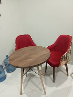 Coffee table with velvet plush chairs