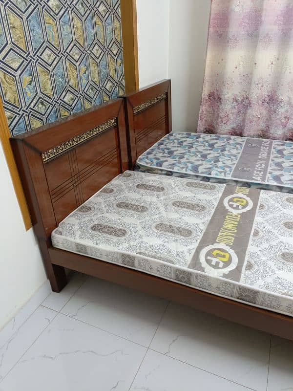 2 single bed with mattresses 3