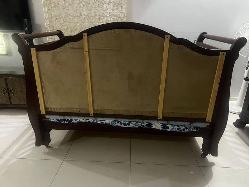 Title: Elegant Wooden Baby Crib with Upholstered Headboard 1