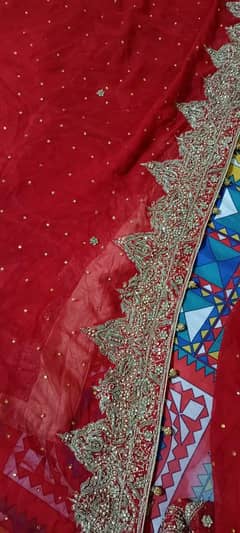 wedding lehnga red colour with golden stone work