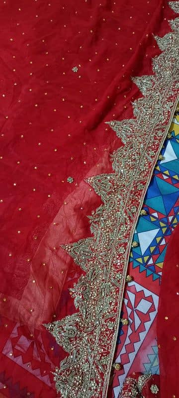 wedding lehnga red colour with golden stone work 0