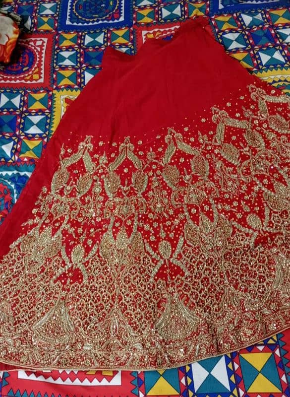 wedding lehnga red colour with golden stone work 1