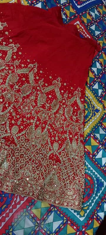 wedding lehnga red colour with golden stone work 2