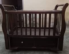 baby wooden cot and wooden Chester.