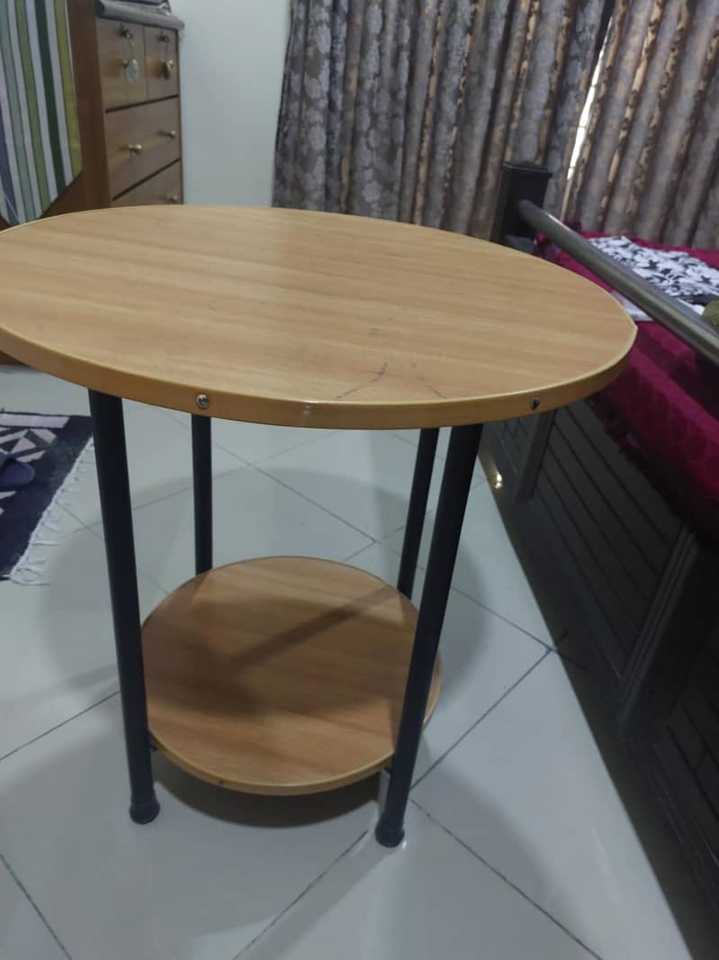 Round wooden table with metal legs 0