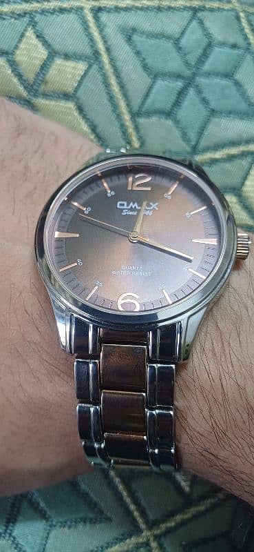 Omax Gold-Plated Analog Watch - Like New" 1