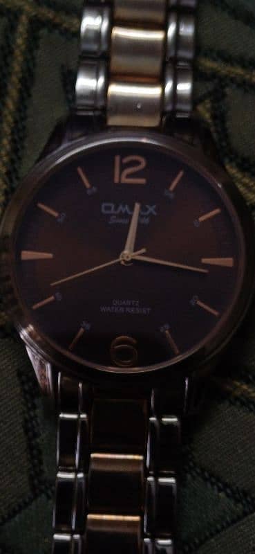 Omax Gold-Plated Analog Watch - Like New" 12