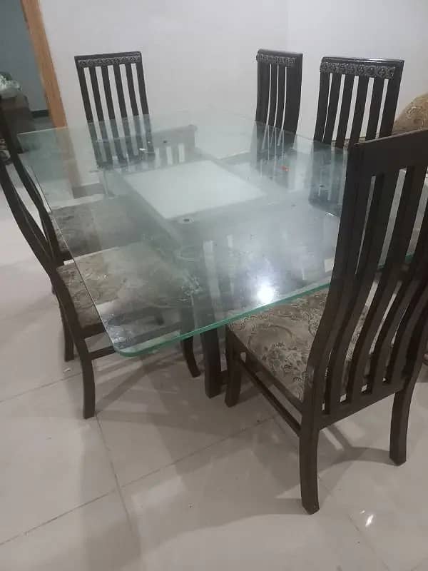 Dining Table for sale, Glass 12mm, wooden stand , chairs 8