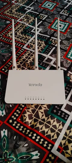 Tenda 3 antenna router power bank and onu device