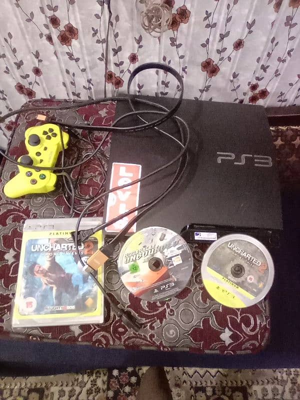 PS3 with remote charger cable  2 CD  with HDMI cable with on off cable 2