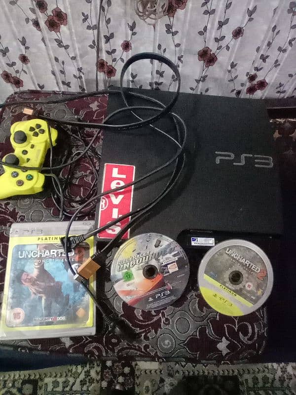 PS3 with remote charger cable  2 CD  with HDMI cable with on off cable 4