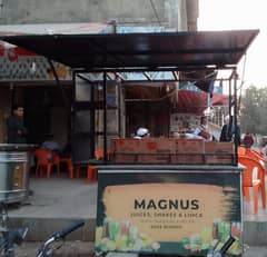 food stall, counter for chips, limca soup, french fries.