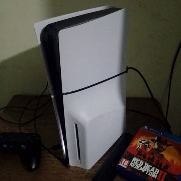 ps5 slim with two controllers and it's almost new with two games load 0