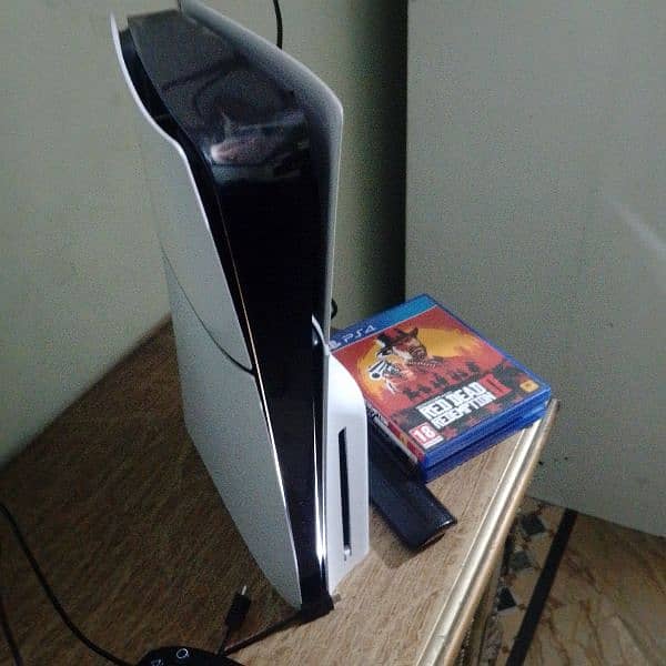 ps5 slim with two controllers and it's almost new with two games load 1