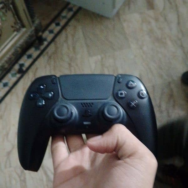 ps5 slim with two controllers and it's almost new with two games load 2