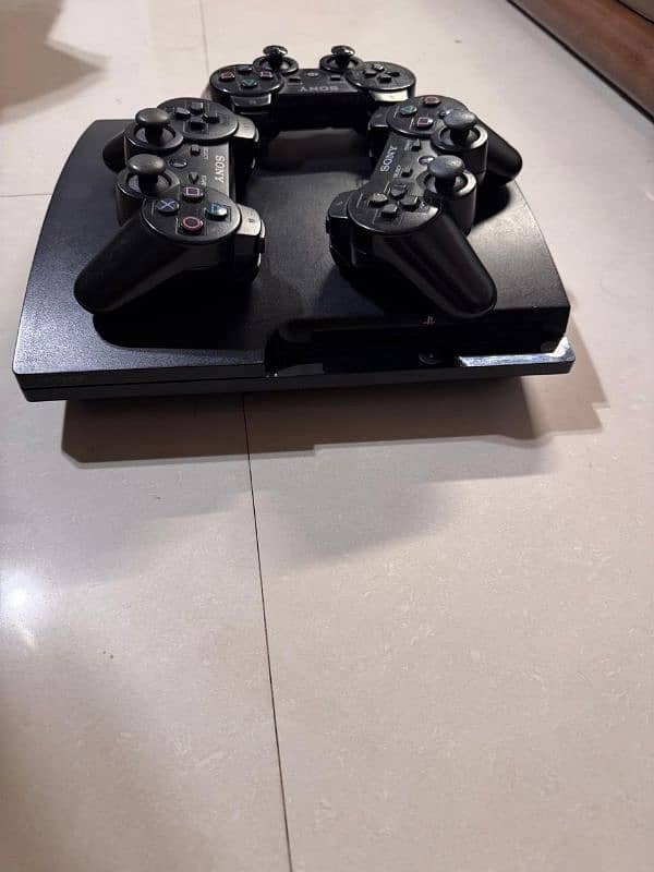 ps3 console with 3 controllers 2