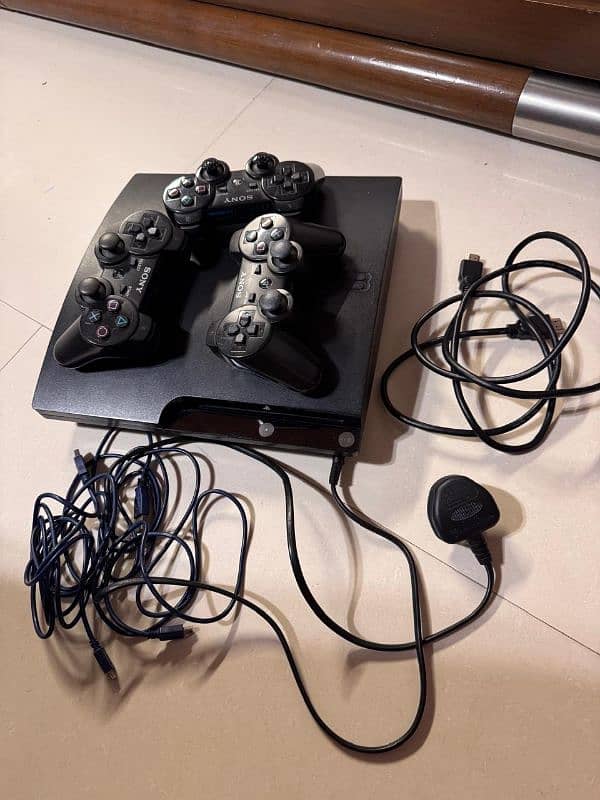 ps3 console with 3 controllers 3