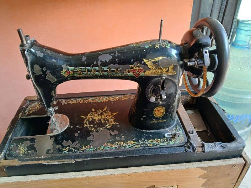 I am selling SINGER sewing machine with stand 3