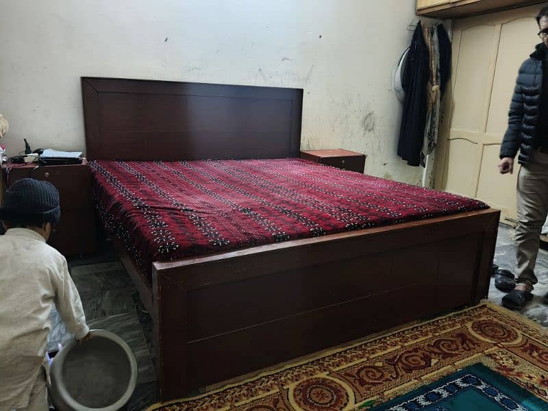 Brown color bed without mattress. 4