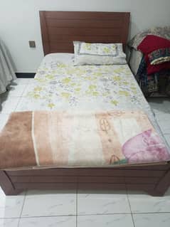 single wooden bed in good condition with molty foam mattress