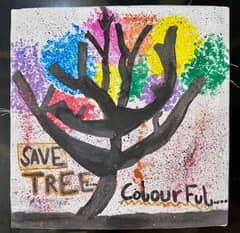 Painting of a colourful tree by school kid beautiful