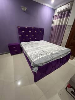 king size double bed with side table