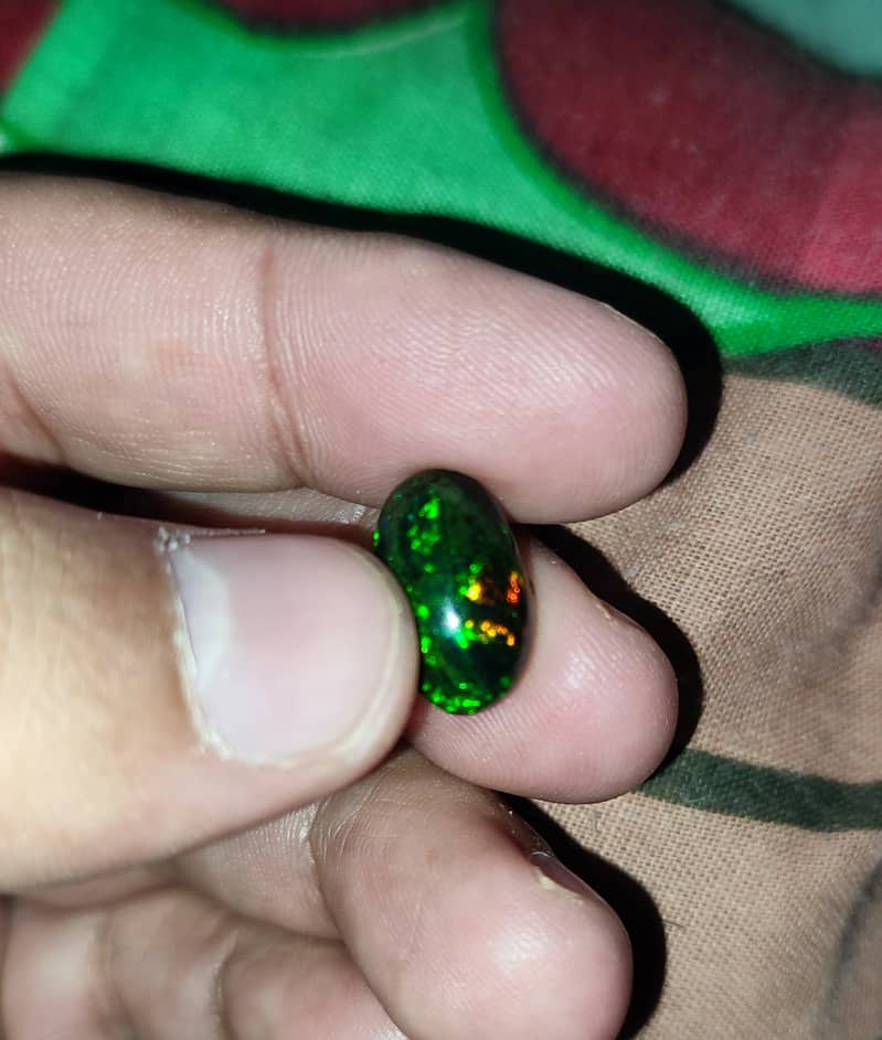 4.65 Carat Ethiopian black Opal Opal with full fires and all colors 1