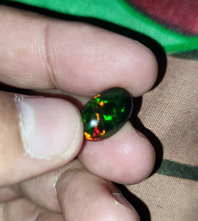 4.65 Carat Ethiopian black Opal Opal with full fires and all colors 2