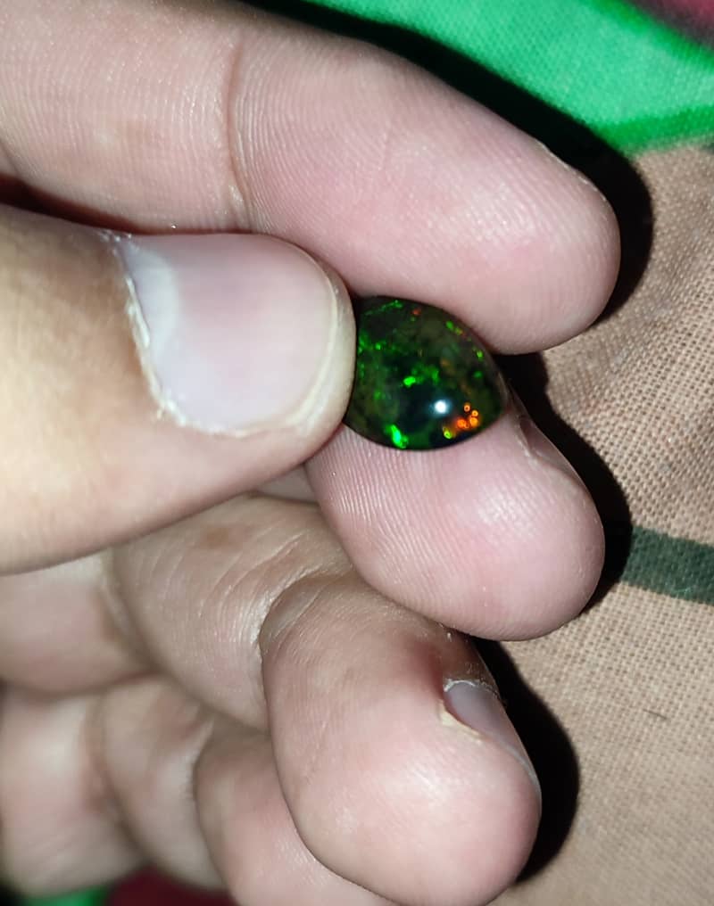 4.65 Carat Ethiopian black Opal Opal with full fires and all colors 3