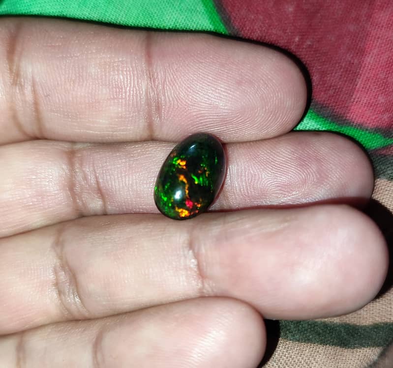 4.65 Carat Ethiopian black Opal Opal with full fires and all colors 4