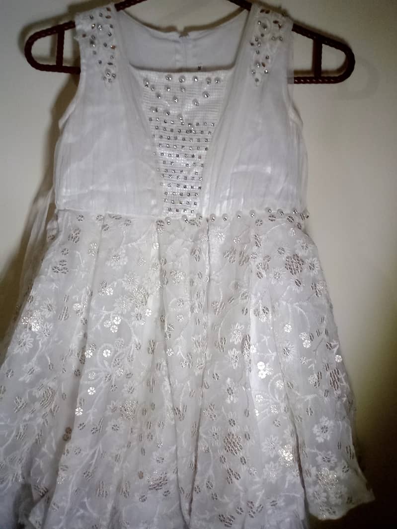 Fancy dress for girl in white colour in used with diamond nets button 3