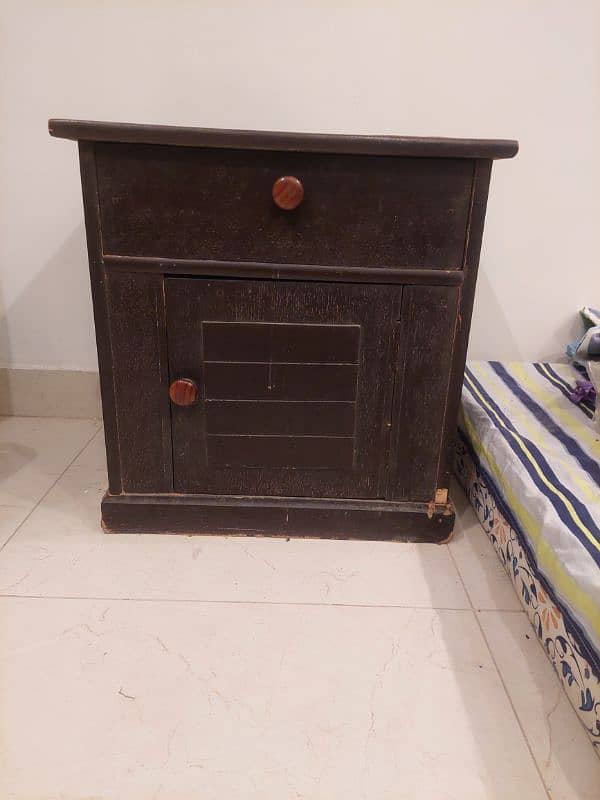 Wooden bed with a side table and dressing table not to old. 4