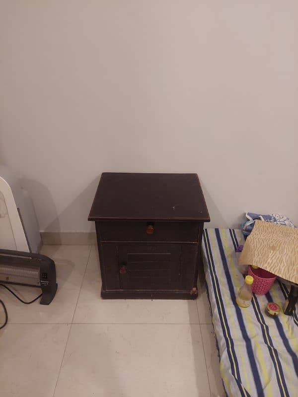 Wooden bed with a side table and dressing table not to old. 6