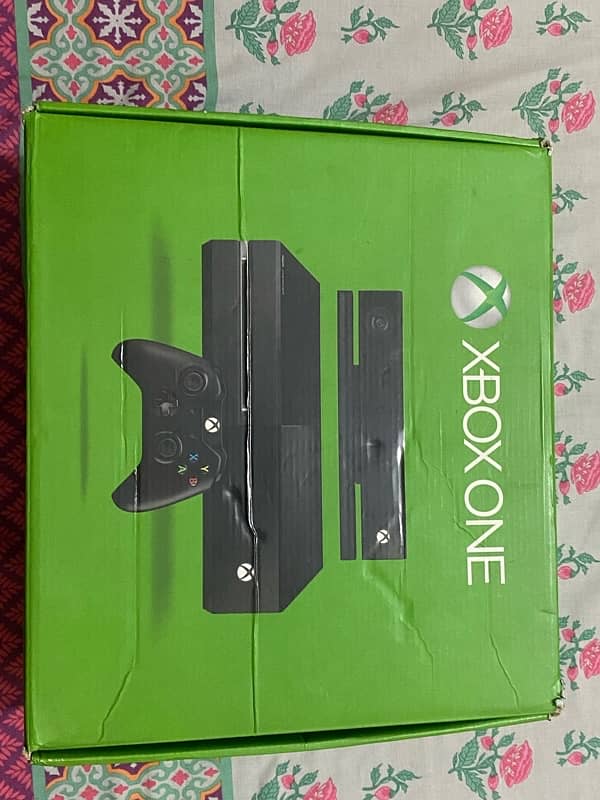 Xbox one along with one additional controller,charging kit and 4 games 0