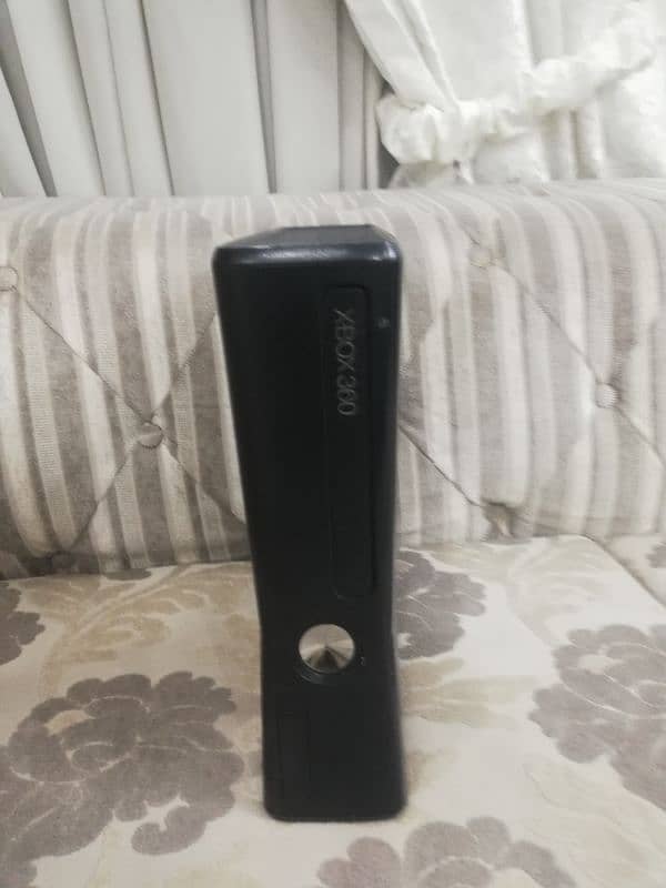 Xbox 360 slim edition in 10 by 10 condition with the box price 2