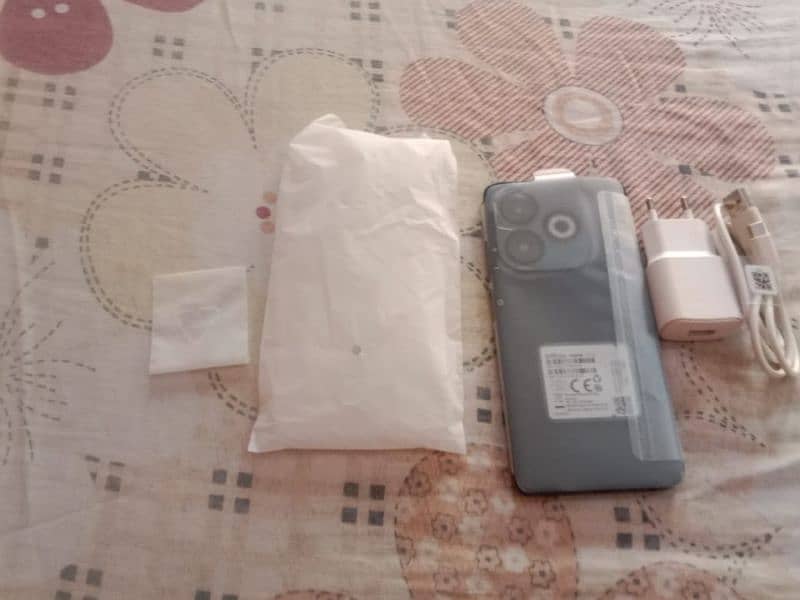 iam selling my Infinix smart 8 pro with box and charger and case 0