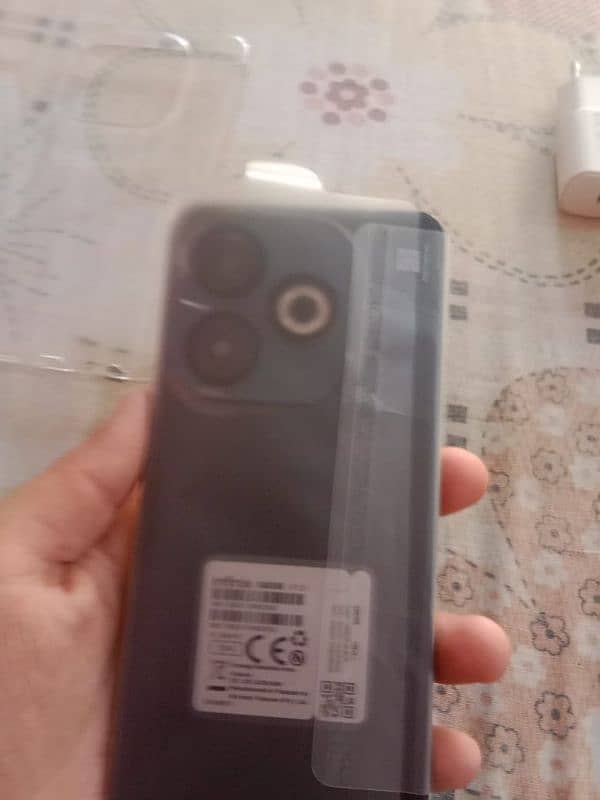 iam selling my Infinix smart 8 pro with box and charger and case 2