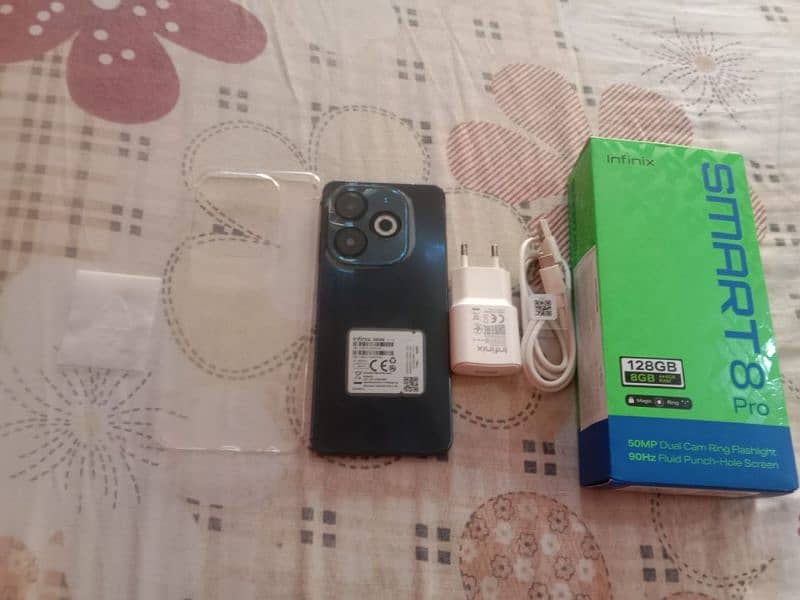 iam selling my Infinix smart 8 pro with box and charger and case 6