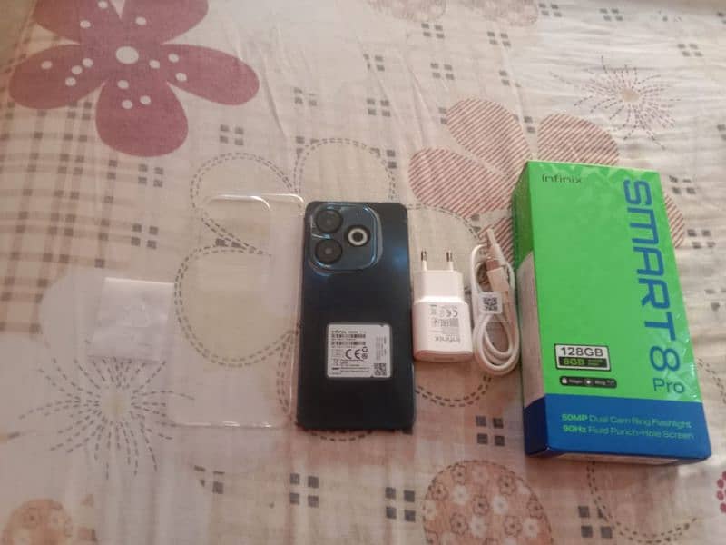 iam selling my Infinix smart 8 pro with box and charger and case 9