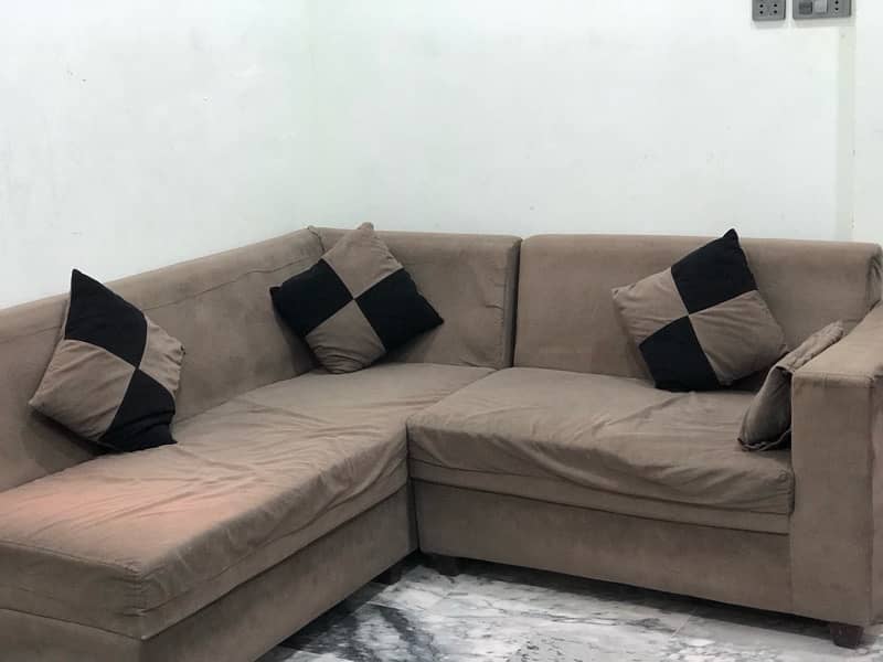 L-shaped sofa with cushions 3