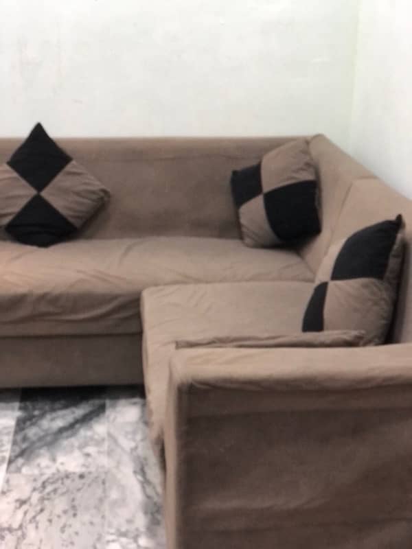 L-shaped sofa with cushions 4