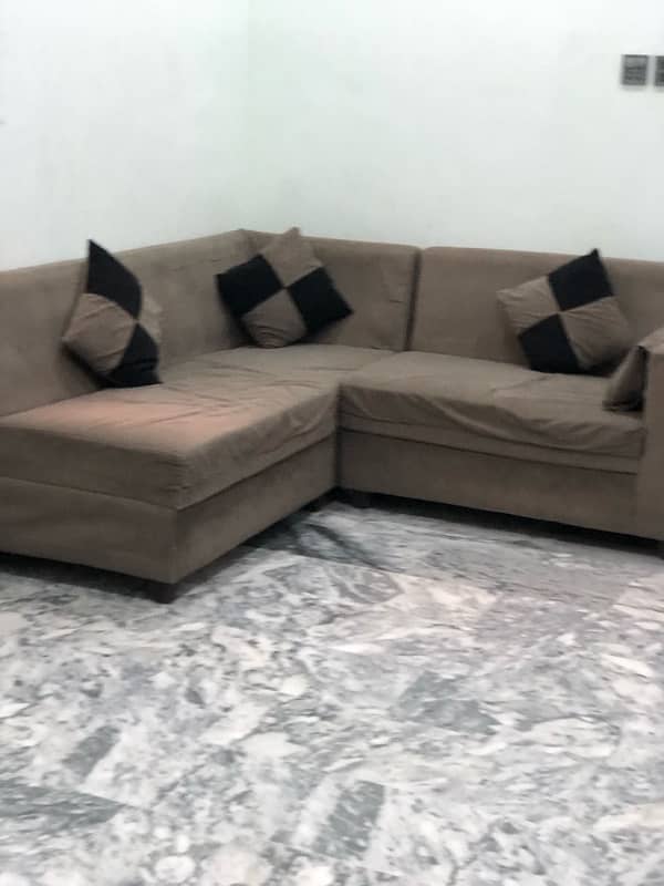 L-shaped sofa with cushions 6