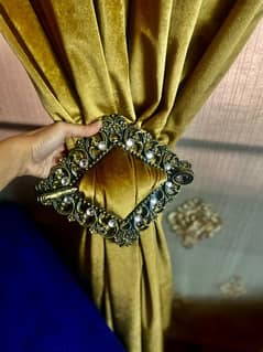 blind with velvet curtain with wood carving along with clips