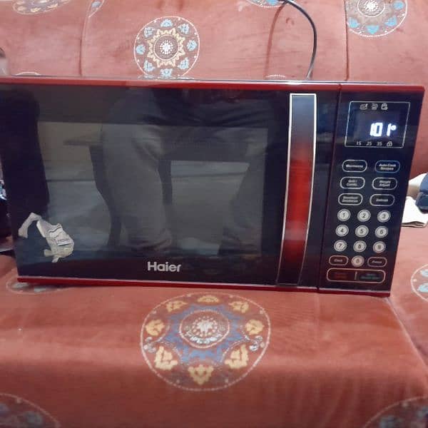 HAIRE MICROWAVE ONLY SLIGHTLY USED WITH BAKING AND GRILL FUNCTION 0