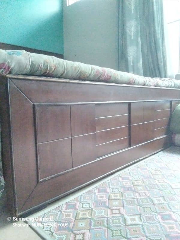 king size wooden bed with side tables and dressing table 1