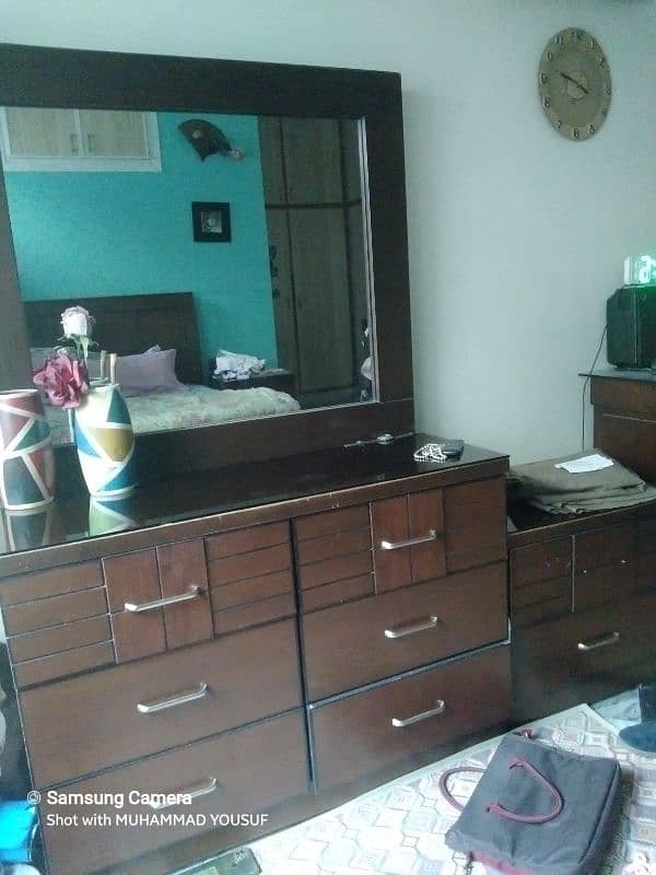 king size wooden bed with side tables and dressing table 3