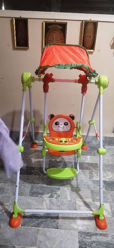 Orange and green swing for kids 0