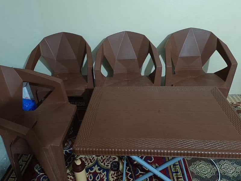 plastic table and 4 chairs urgent sale 0