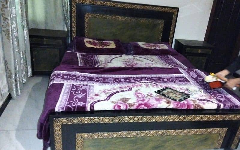 SLIGHTLY Used Bed with Side Table With Dressing Tar 1